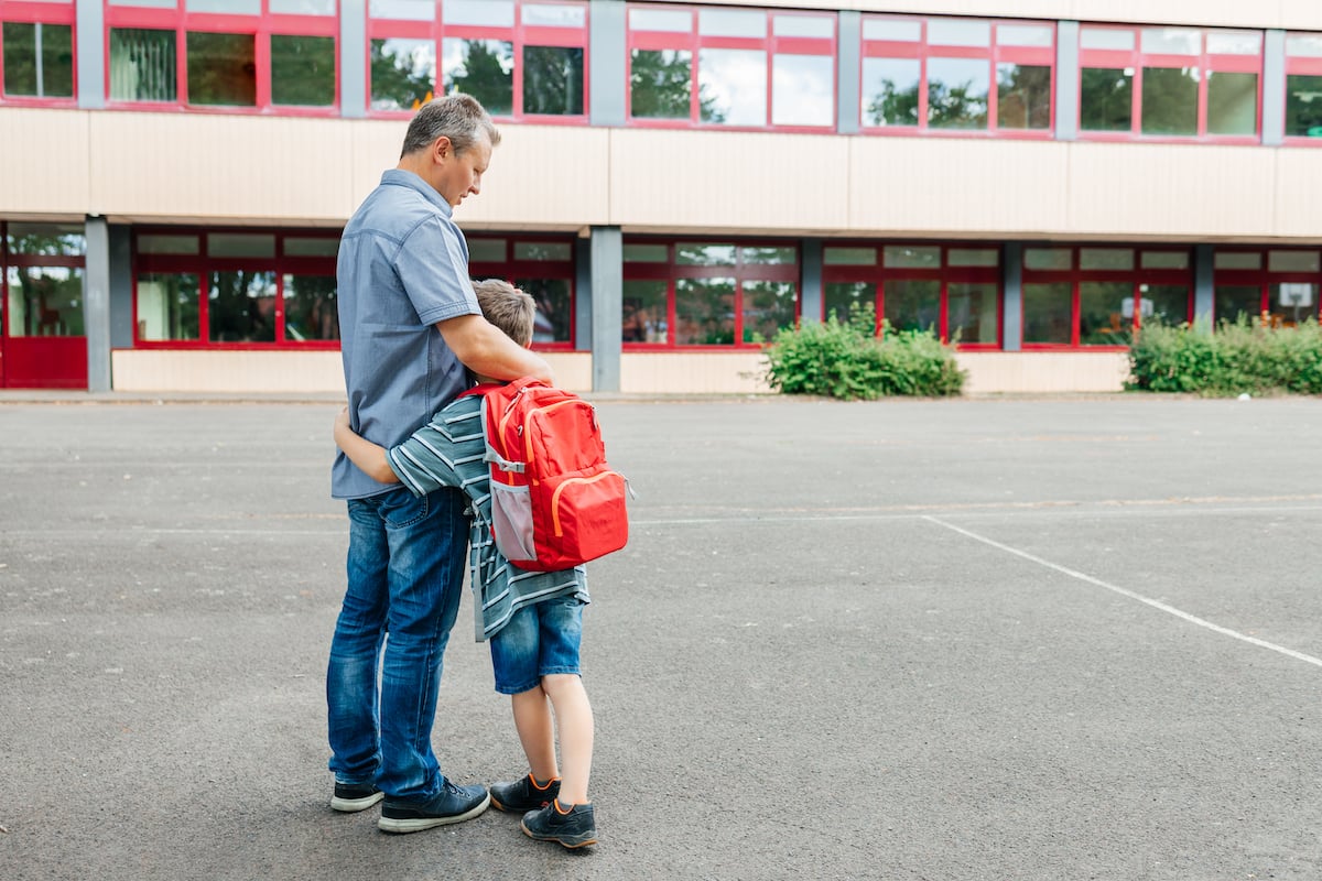 happy-dad-hugs-the-child-of-the-schoolboy-and-esco-2022-08-10-23-56-49-utc