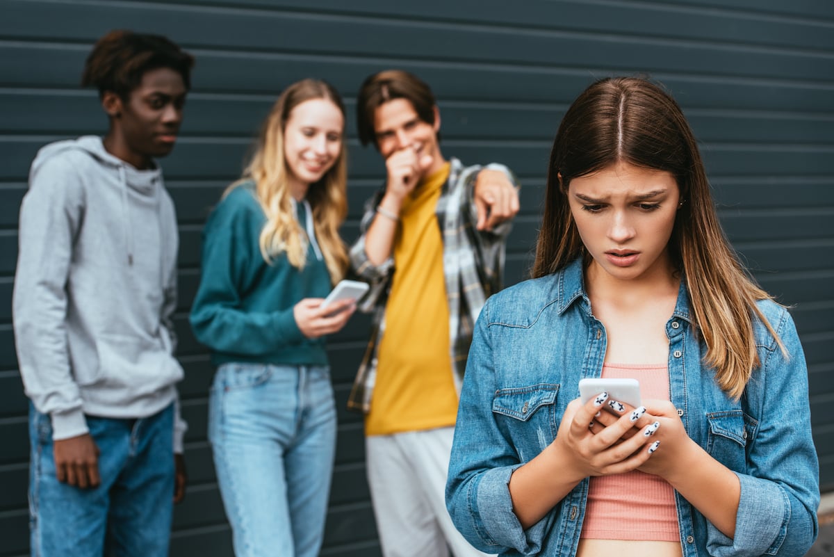 sad teenager being bullied