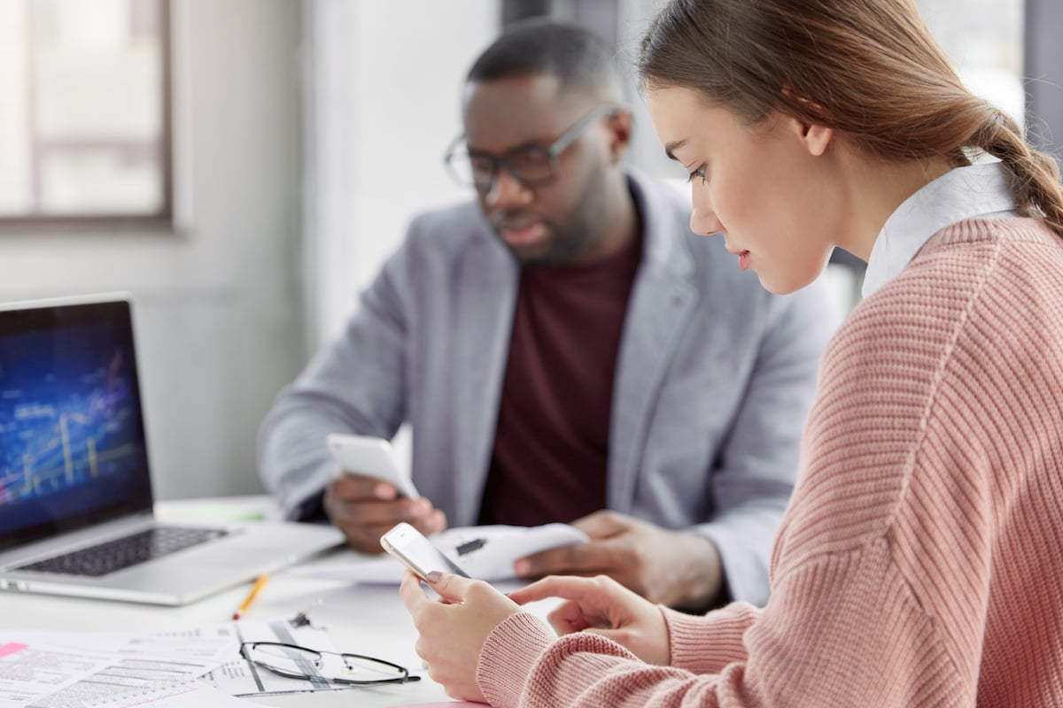male and female coworkers conducting an audit