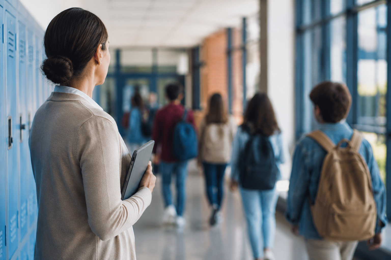 Teacher in hallway supervising students