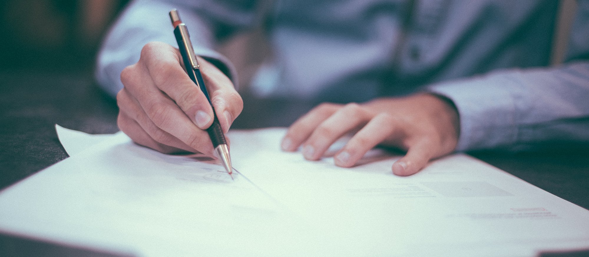 man making notes on the federal commission on school safety