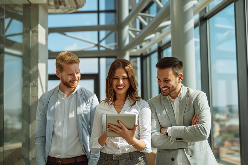 business people looking at tablet