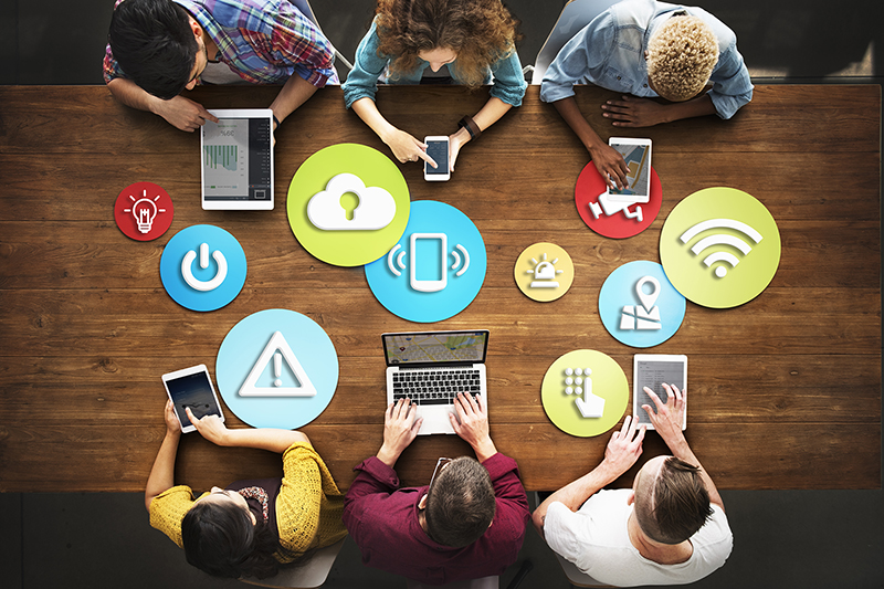 people at a table with safety icons