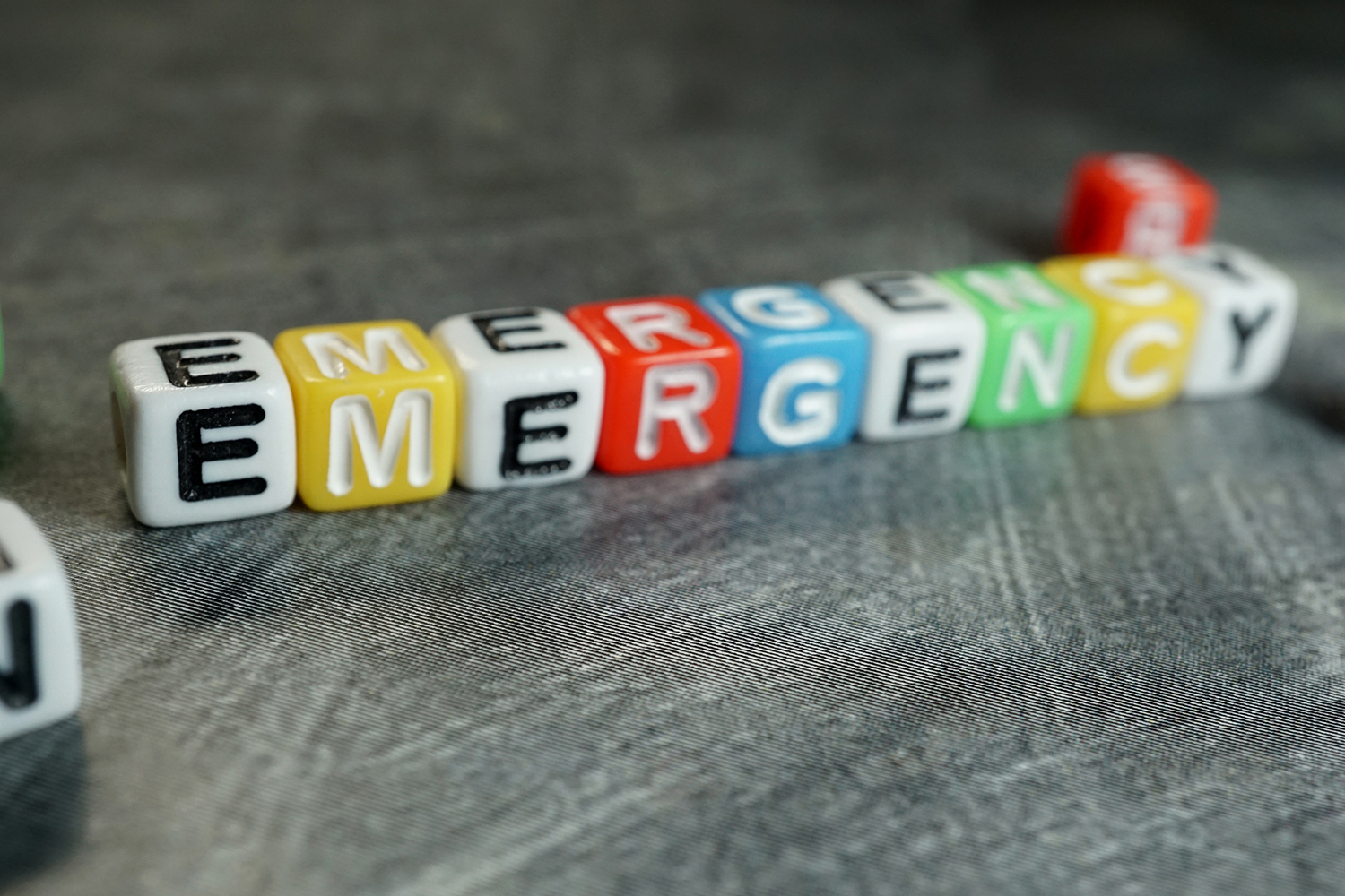 blocks spelling the word emergency