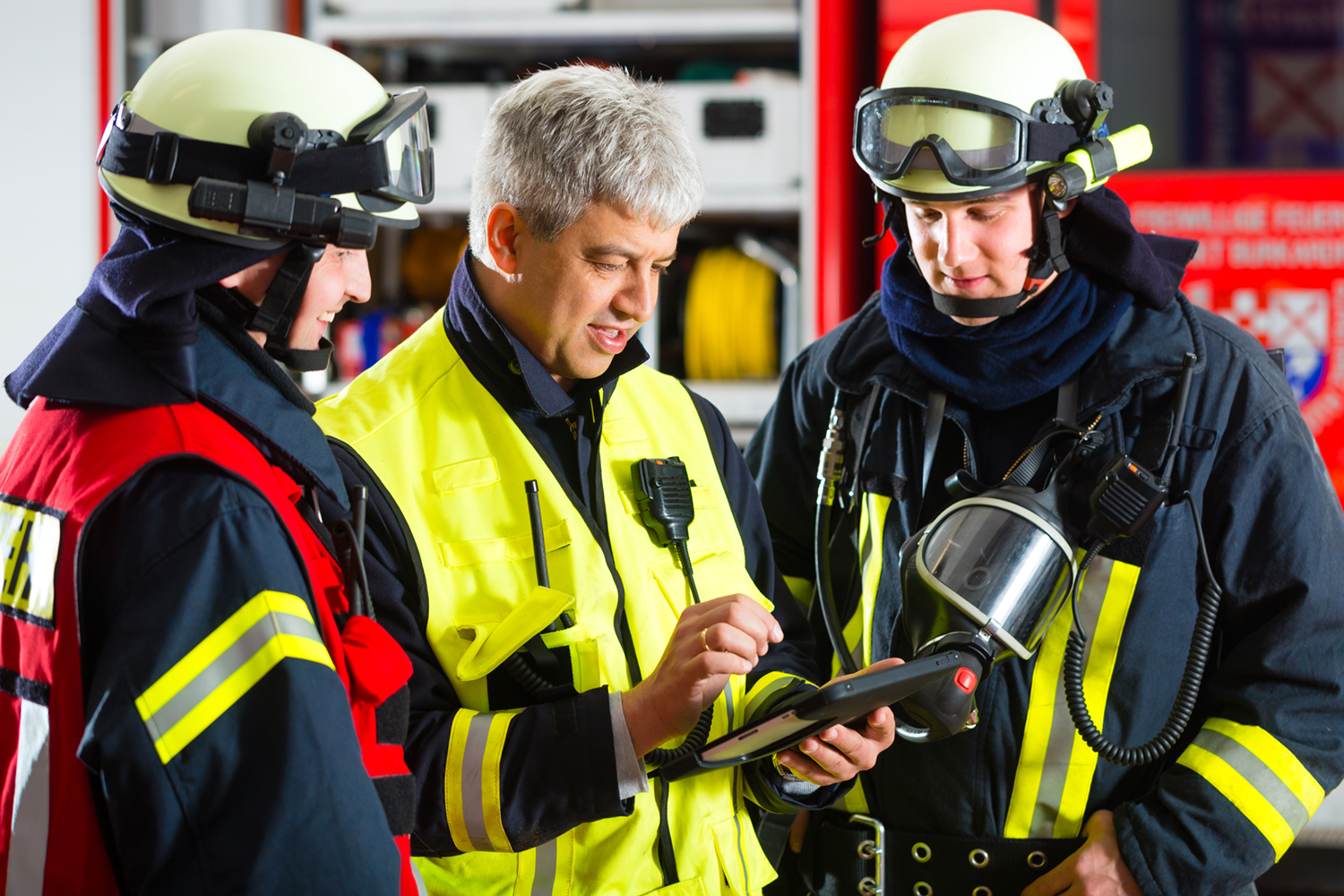 first responders looking at a tablet with crisisgo
