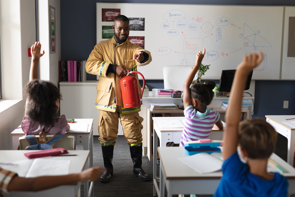 male teacher going over safety in a classroom