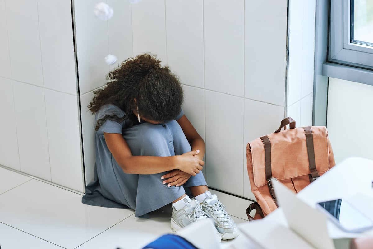 girl feeling scared in school