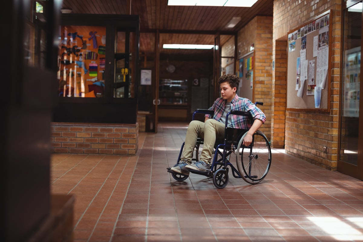 disable school boy in a wheelchair