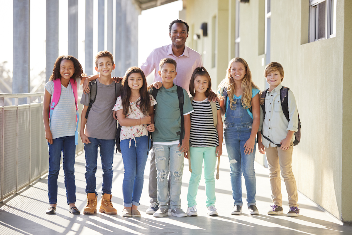 elementary school teacher with students