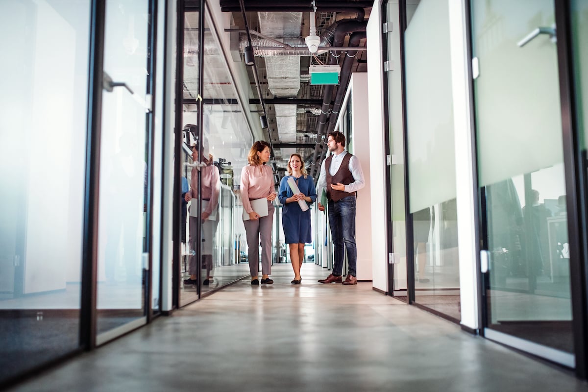 people walking in a business office