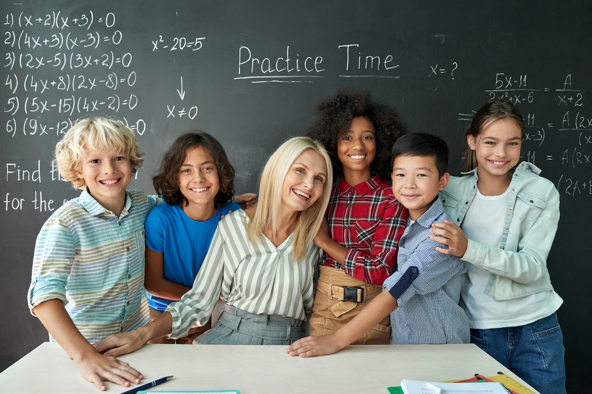 teacher and students smiling