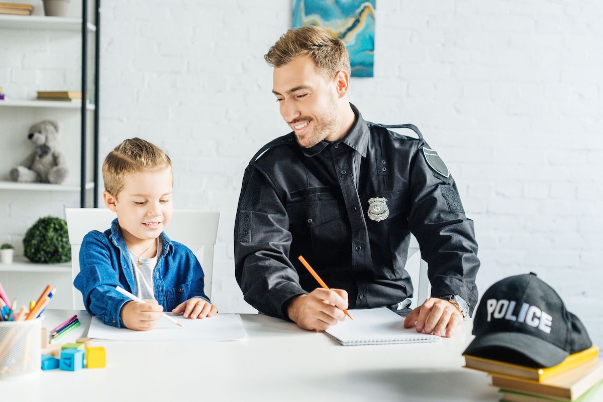 police officer and student drawing