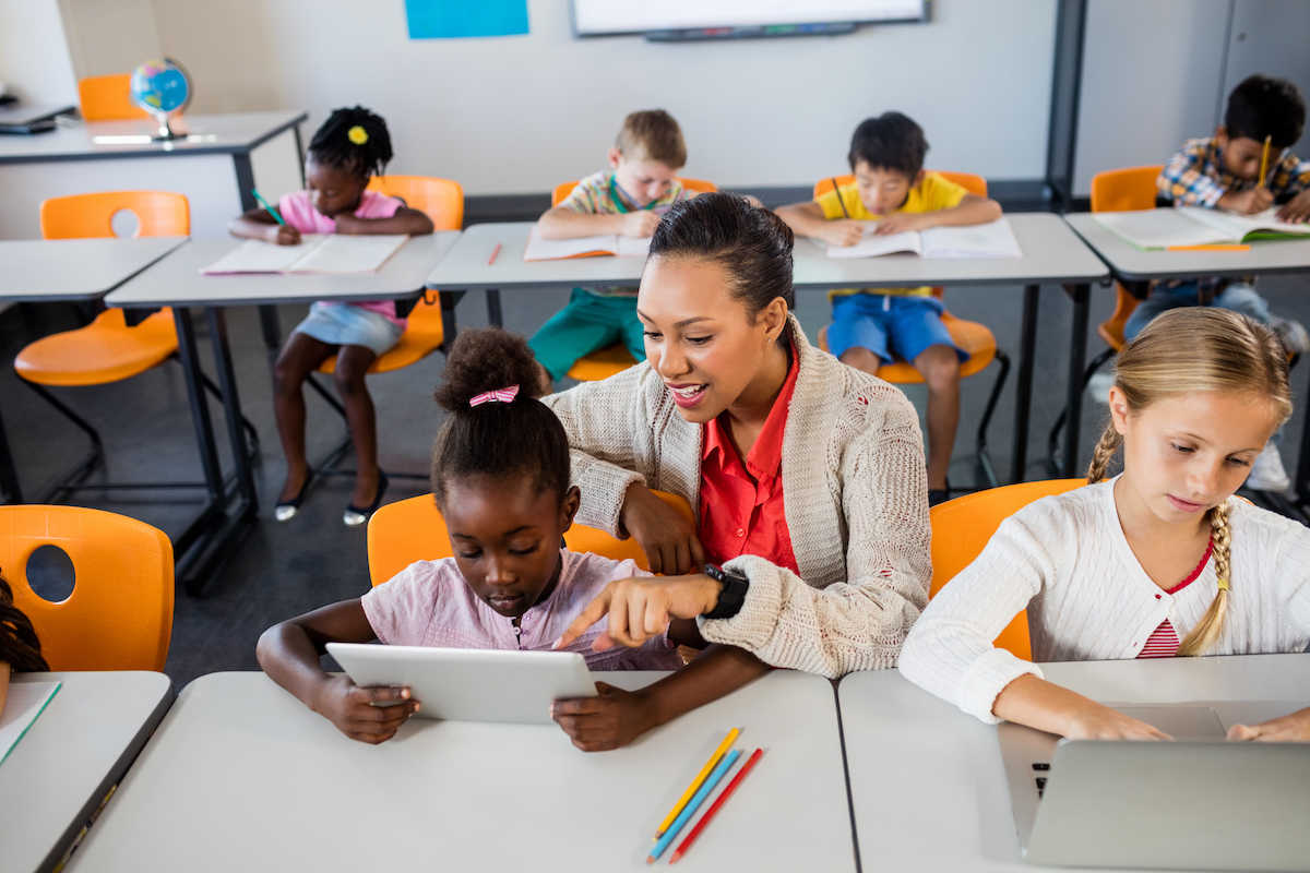 teacher helping a student