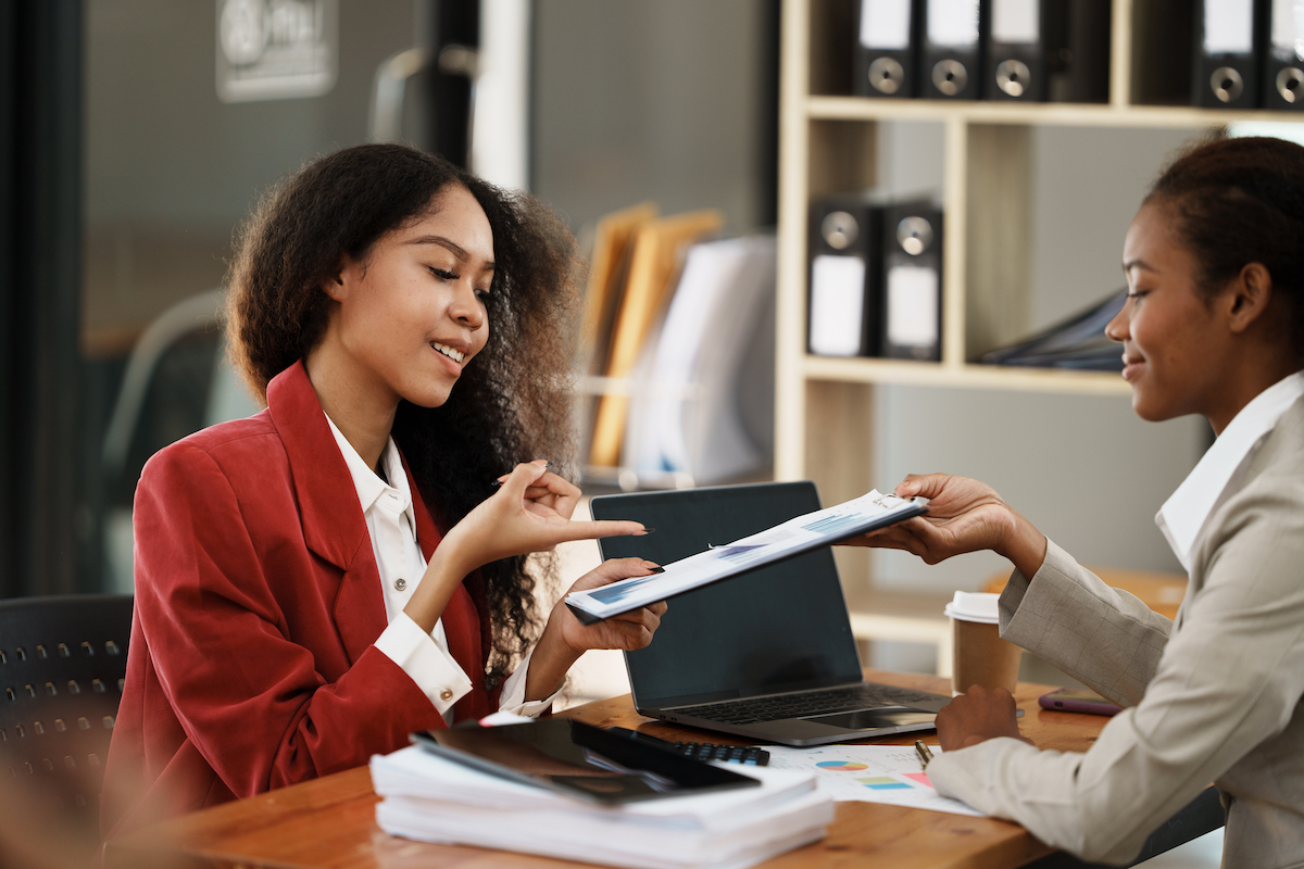 two women discussing plans