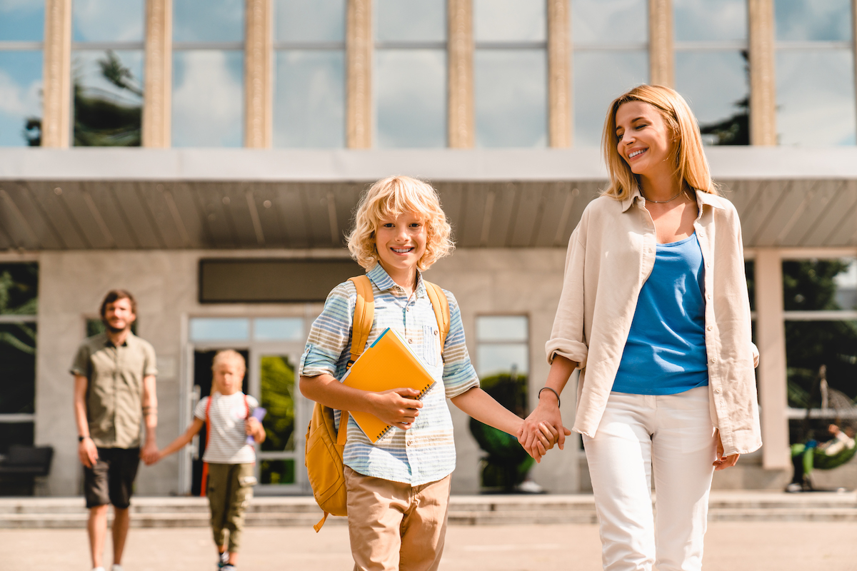 parents escorting their kids off school property