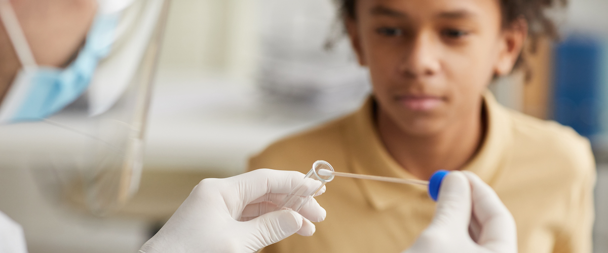 boy taking a covid test