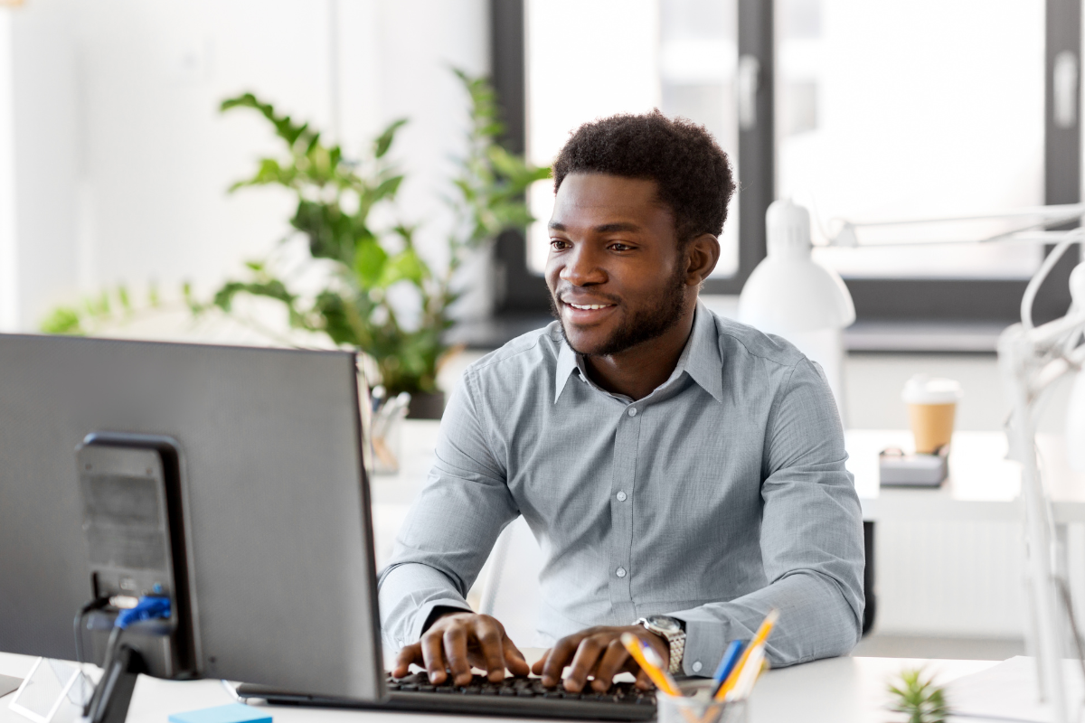 male-smiling-computer