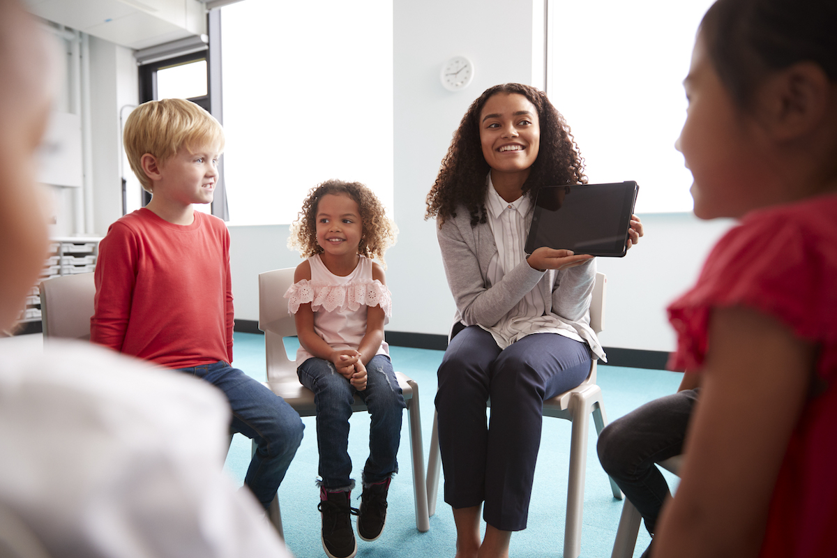 teacher sharing information on a tablet