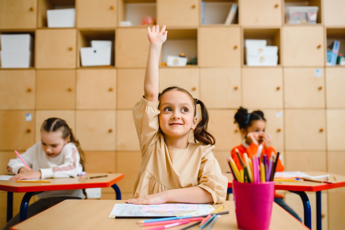 student raising hand
