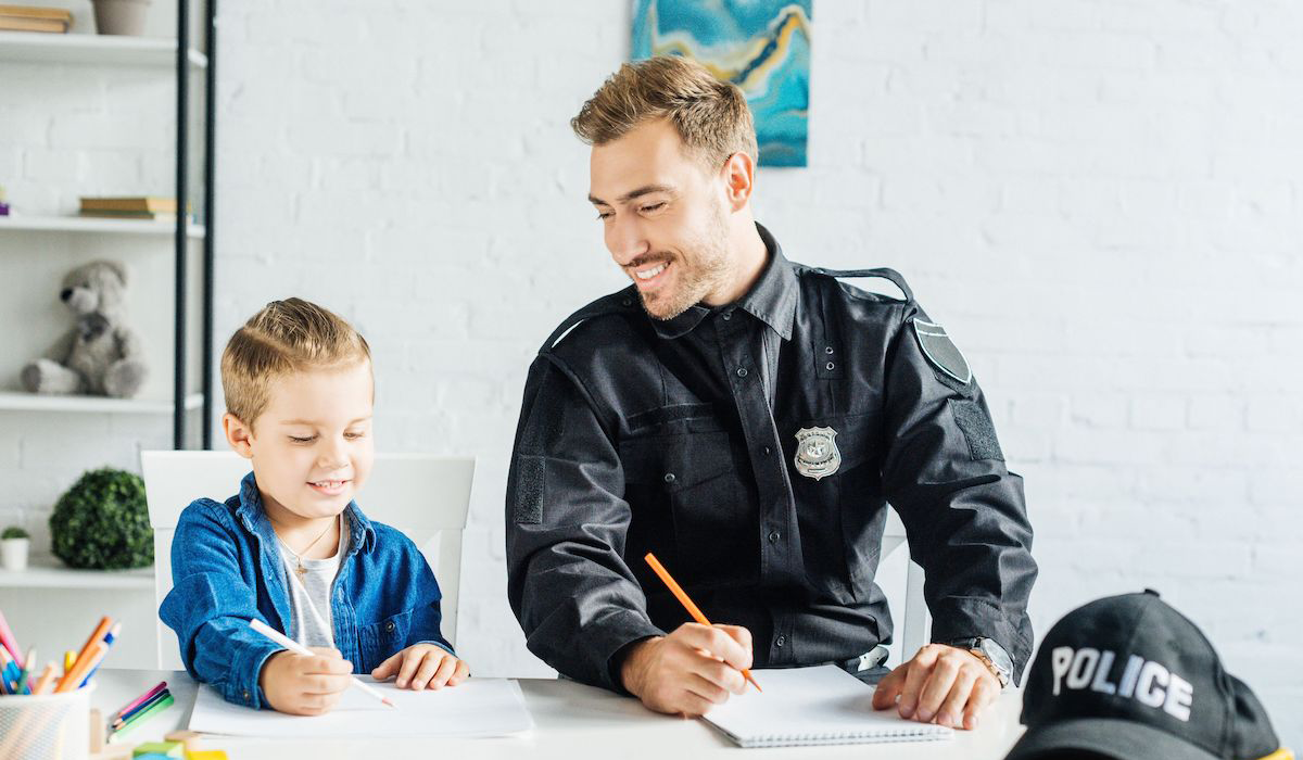 police officer and student drawing